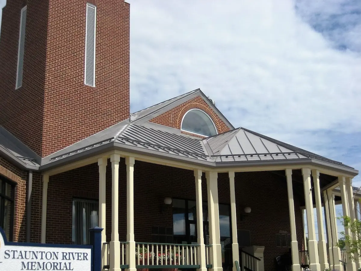 Skilled roofing craftsmen working on a residential roof in Candler-McAfee